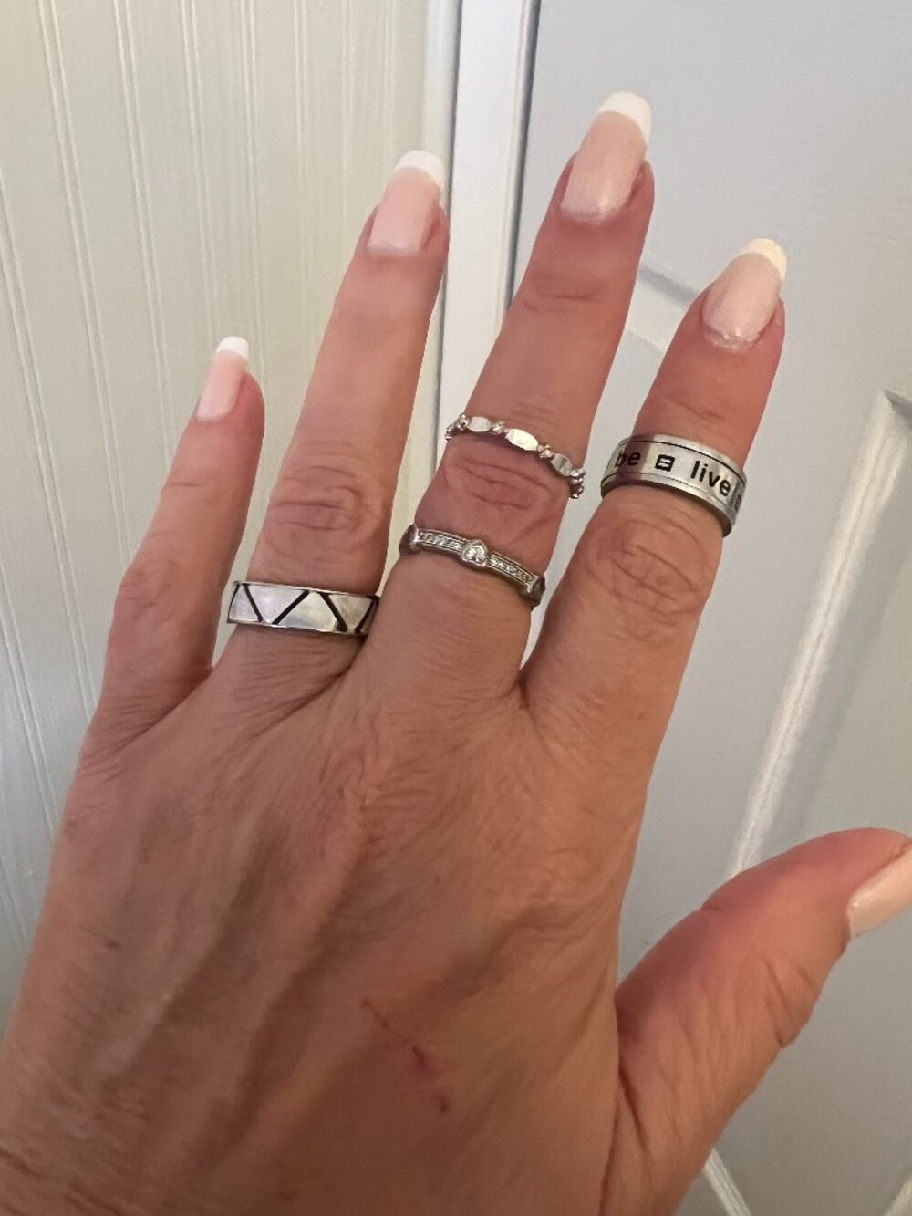 Lot of 4 Silver‑Tone Rings – Mixed Styles Set